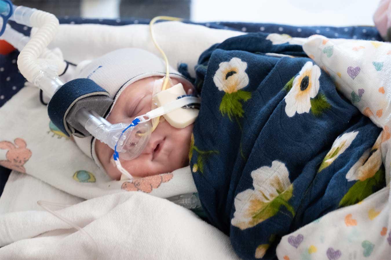 Baby sleeping wearing life saving equipment