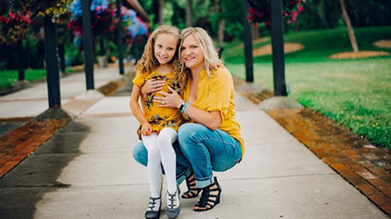 A mother and daughter outside