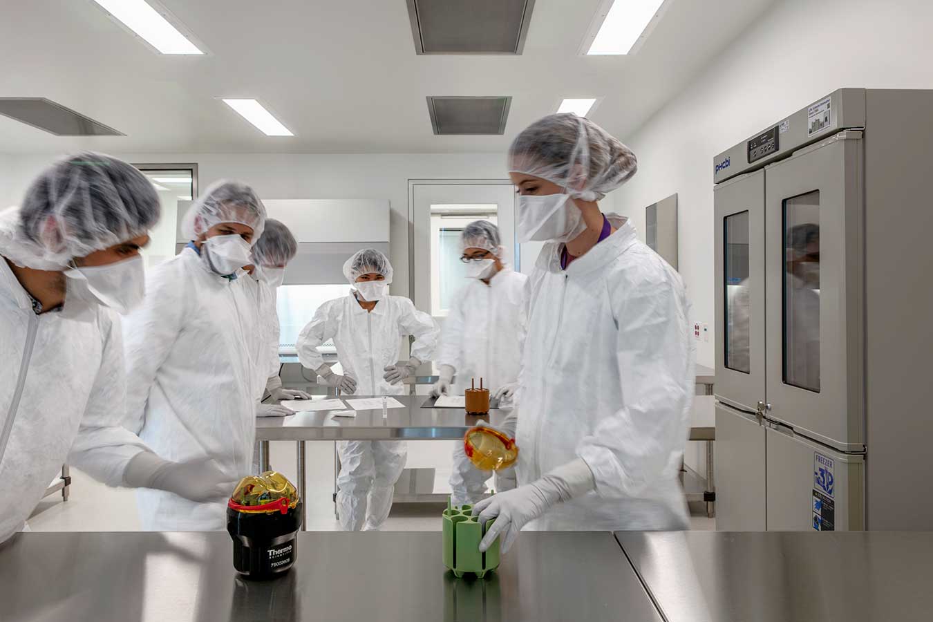 Masked researchers in the lab at Seattle Children's 