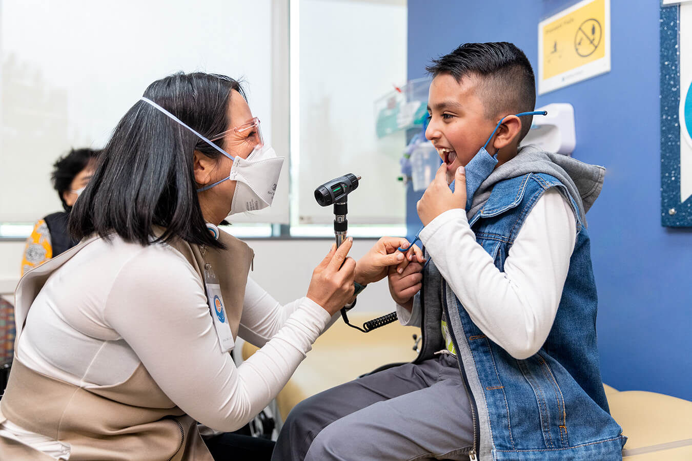 A doctor examines a child