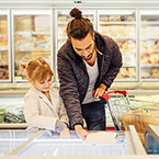 child and parent at grocery store