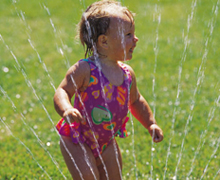 child in sprinkler