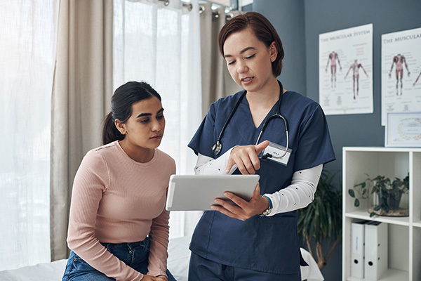 patient and provider talking and walking